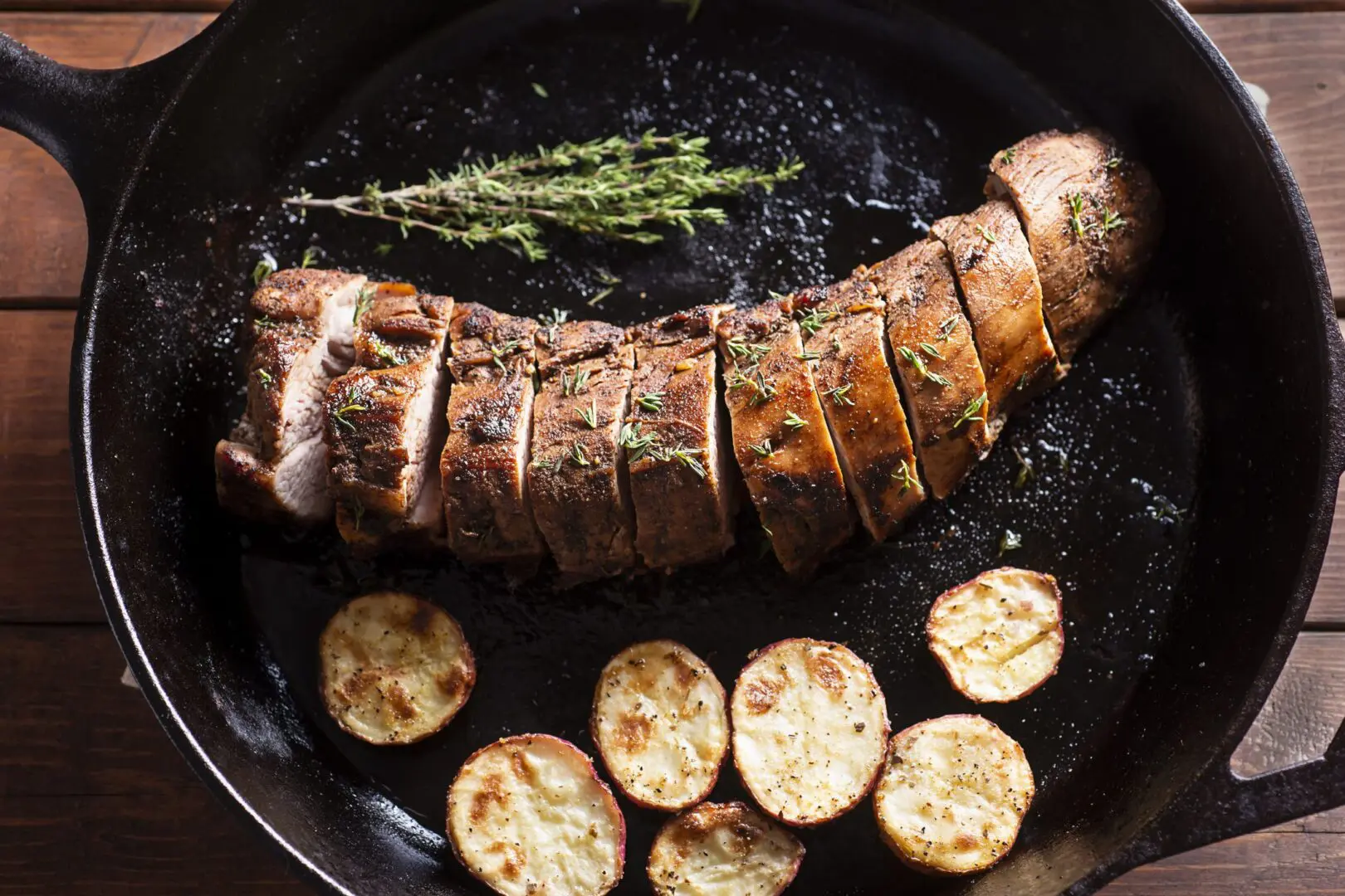 Sliced pork tenderloin with roasted potatoes