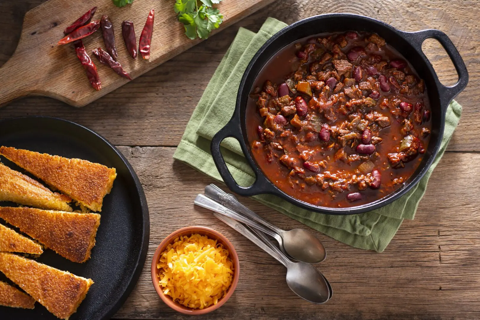 Hearty beef chili with cornbread and cheese