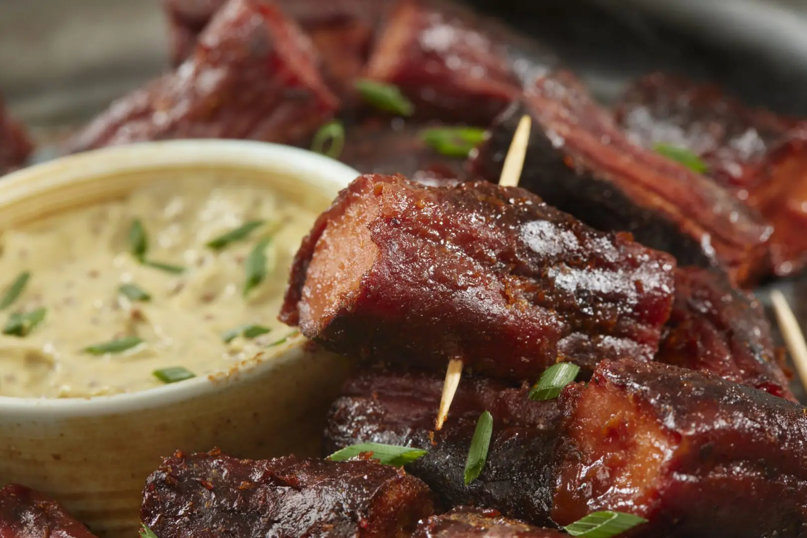 Sticky glazed pork skewers with dipping sauce