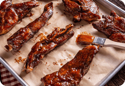 Barbecue ribs with sauce brush.