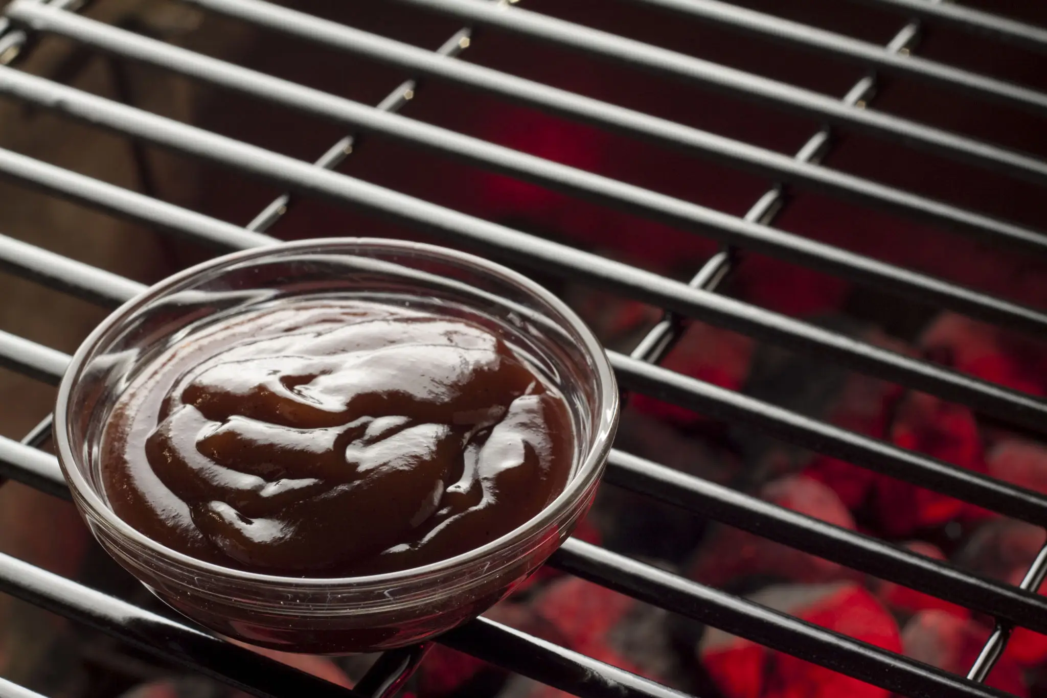 Grilling sauce on barbecue grate