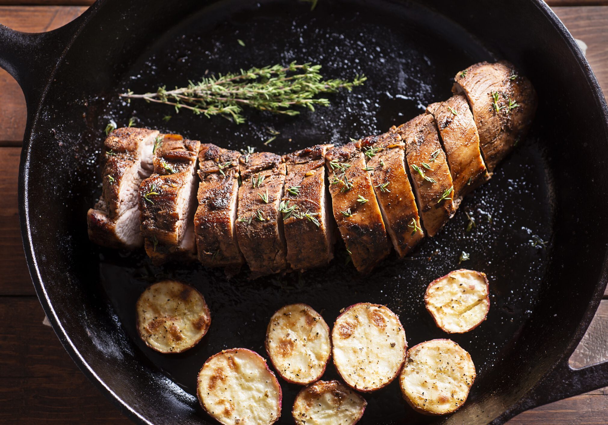 Sliced pork tenderloin with roasted potatoes