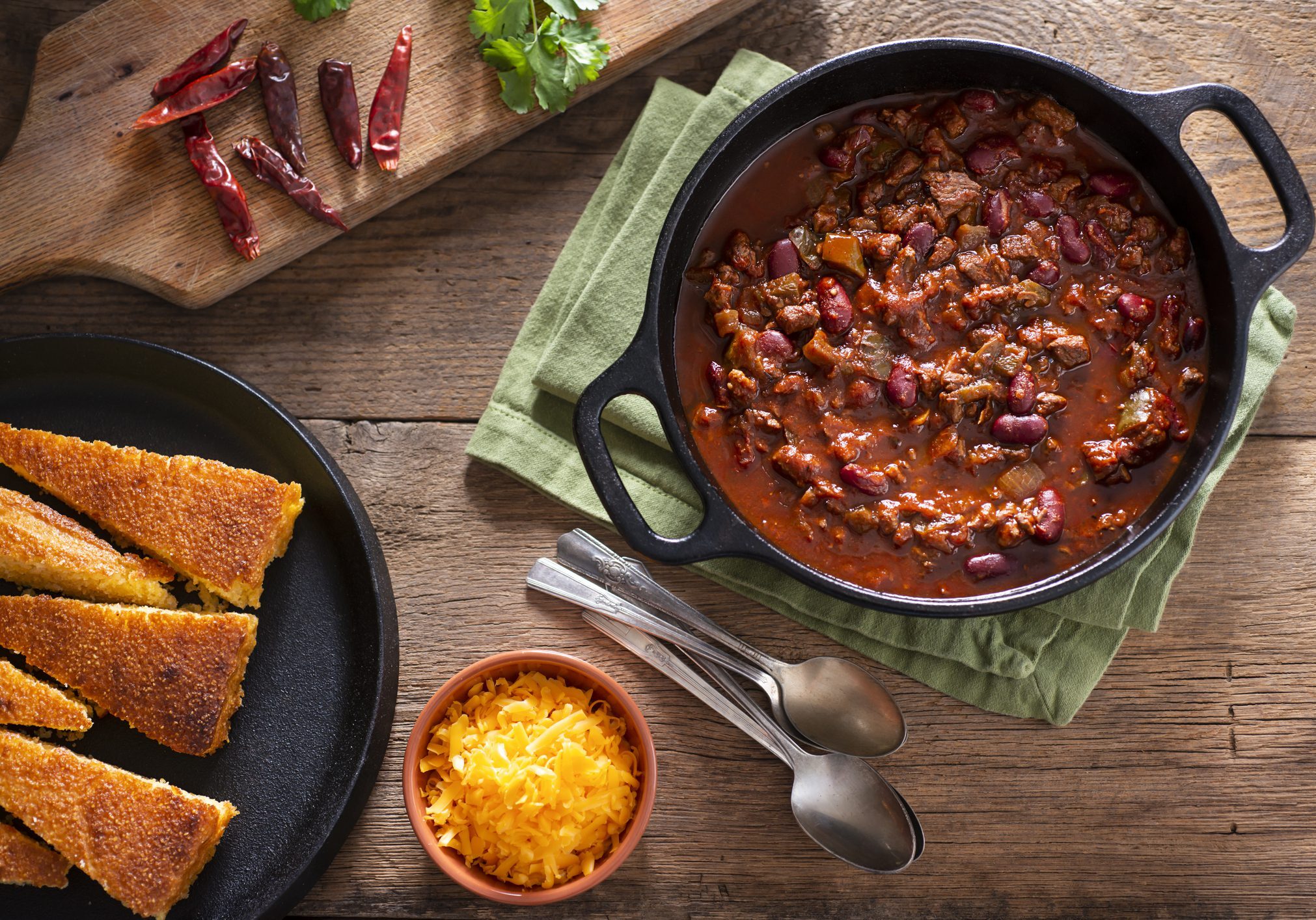Hearty beef chili with cornbread and cheese