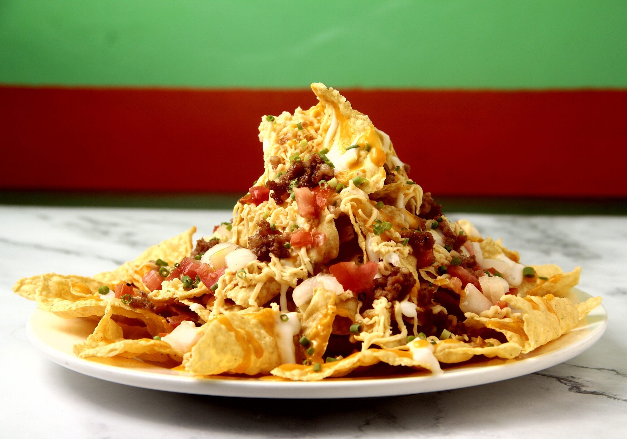 Loaded nachos with cheese, meat, and salsa