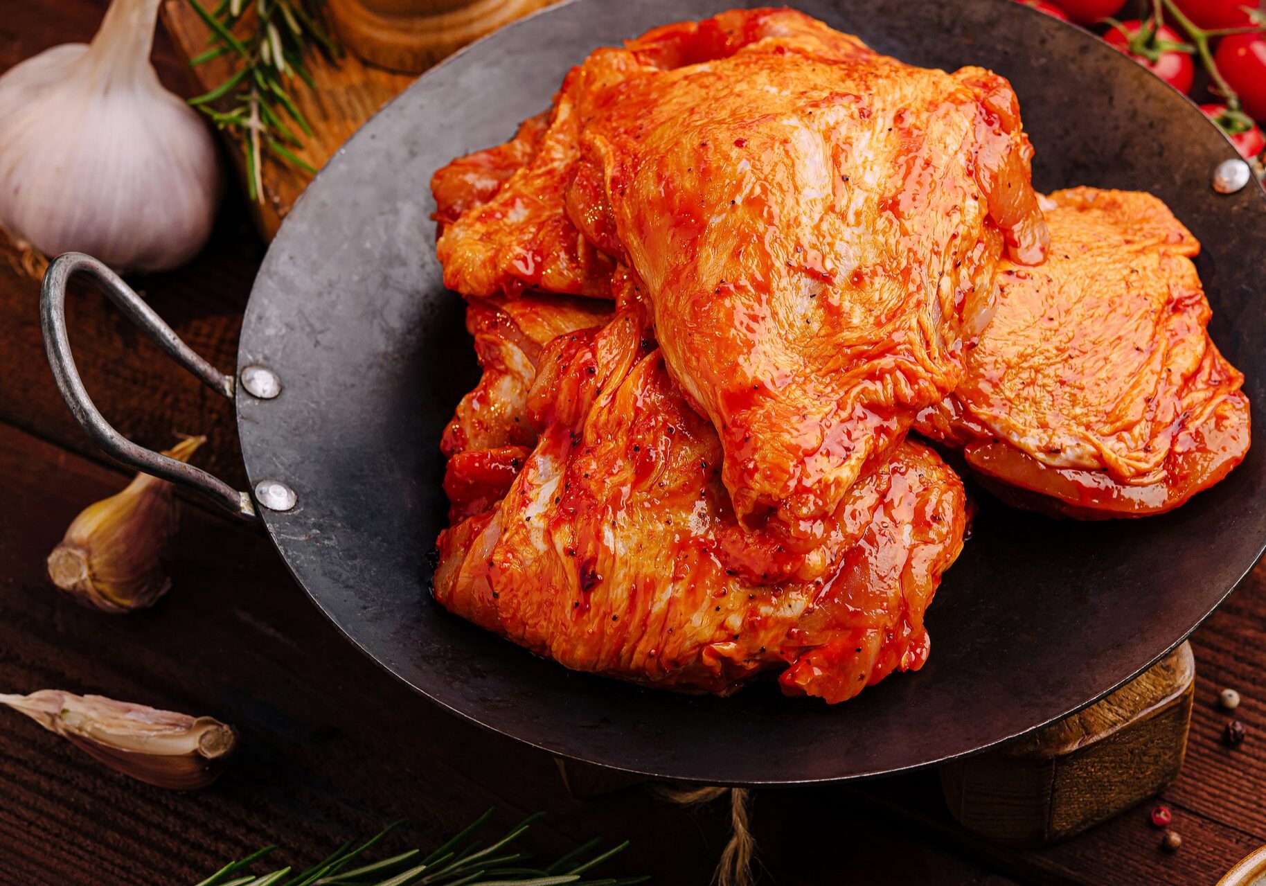 Spicy marinated chicken thighs in cast-iron skillet