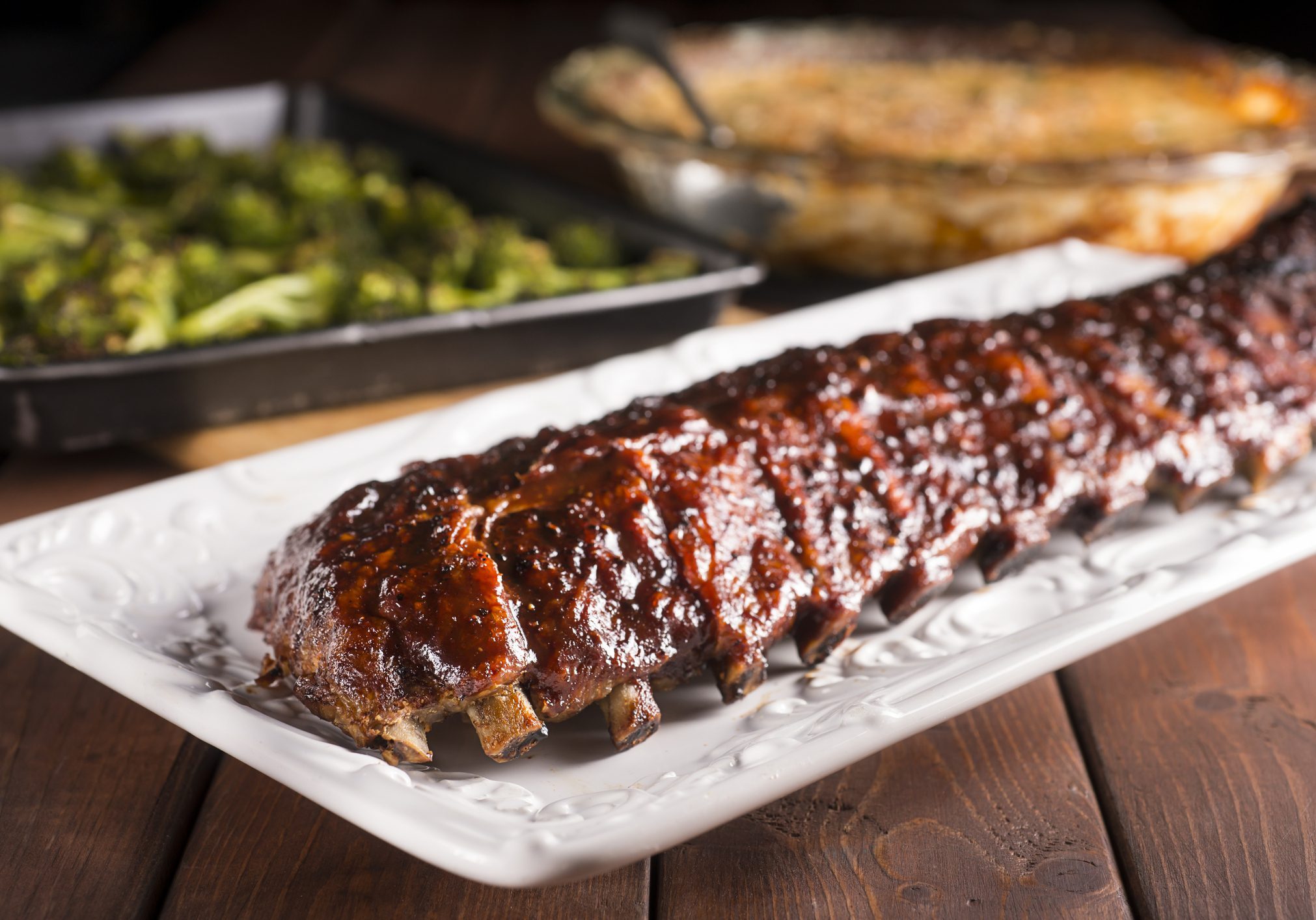 Glazed barbecue pork ribs on white platter
